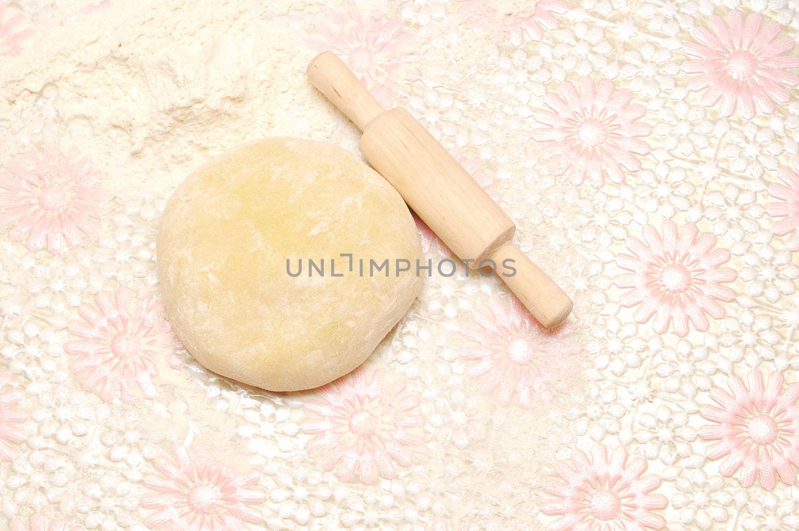 floured rolling pin on dough