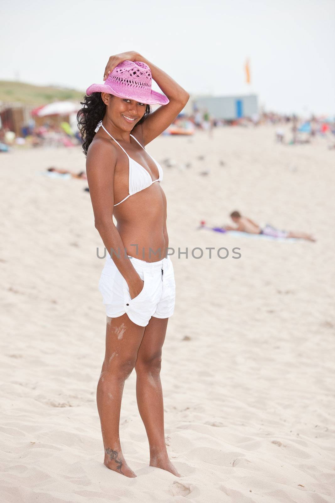 Beautiful girl on the beach in the summer