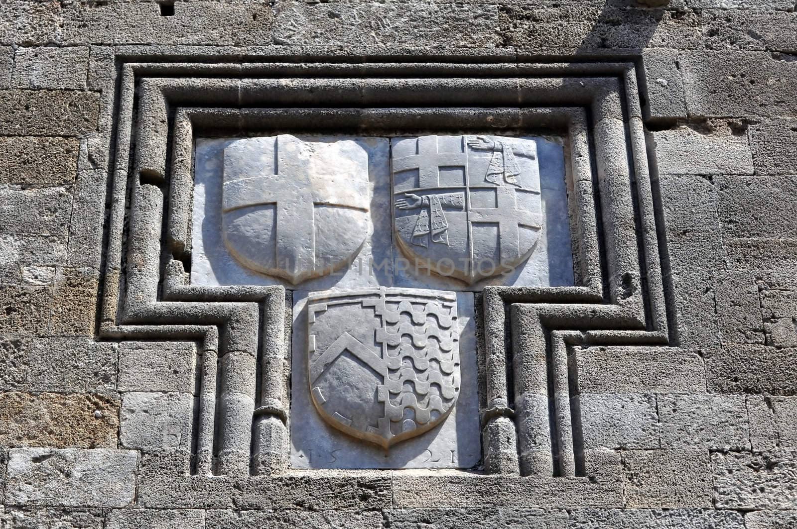 Shield on the walls of the Rhodes medieval fortress. Greece. by FER737NG