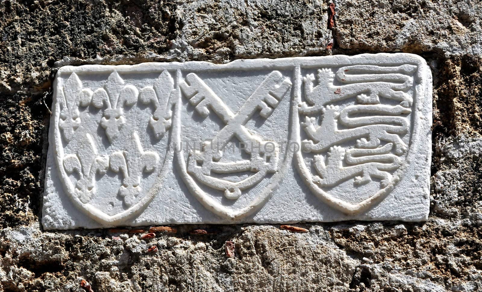 Detail of medieval shield, Rhodes fortress, Greece.