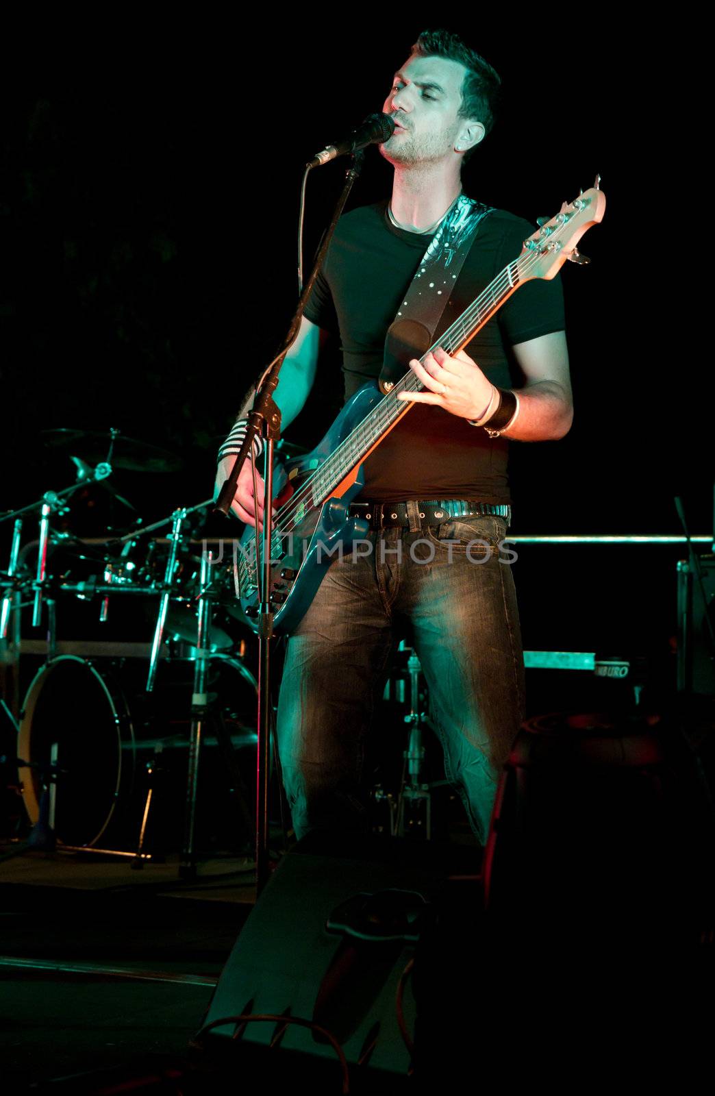 Electric bass-guitar player during a concert
