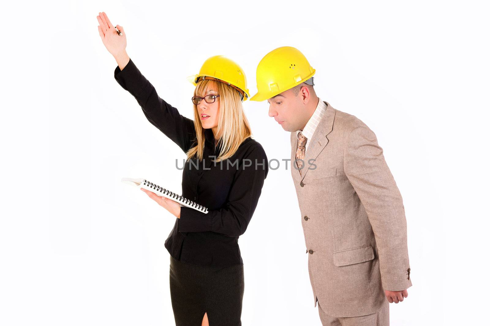 angry businesswoman and architect looking at architectural plans