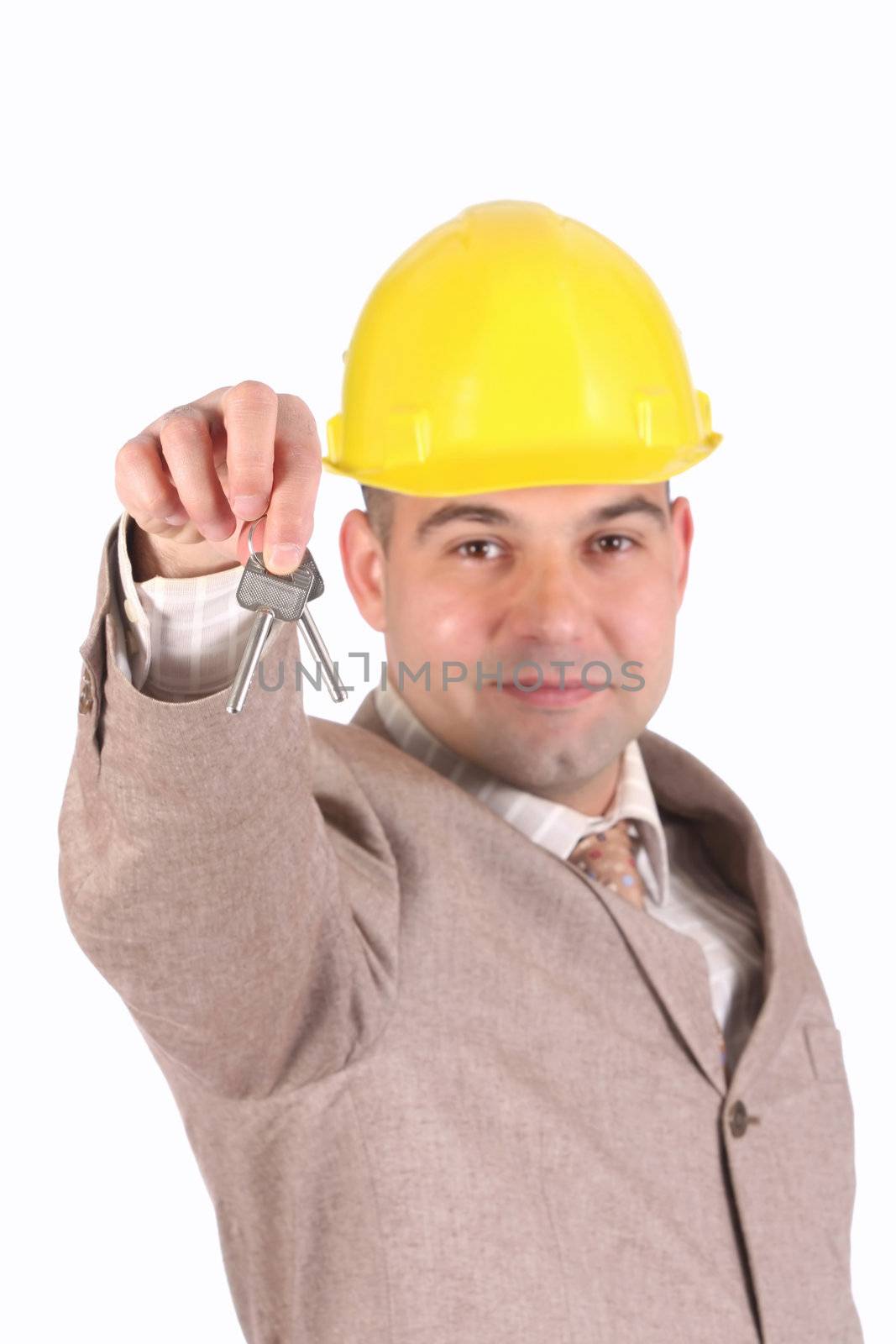 A businessman with keys on white background