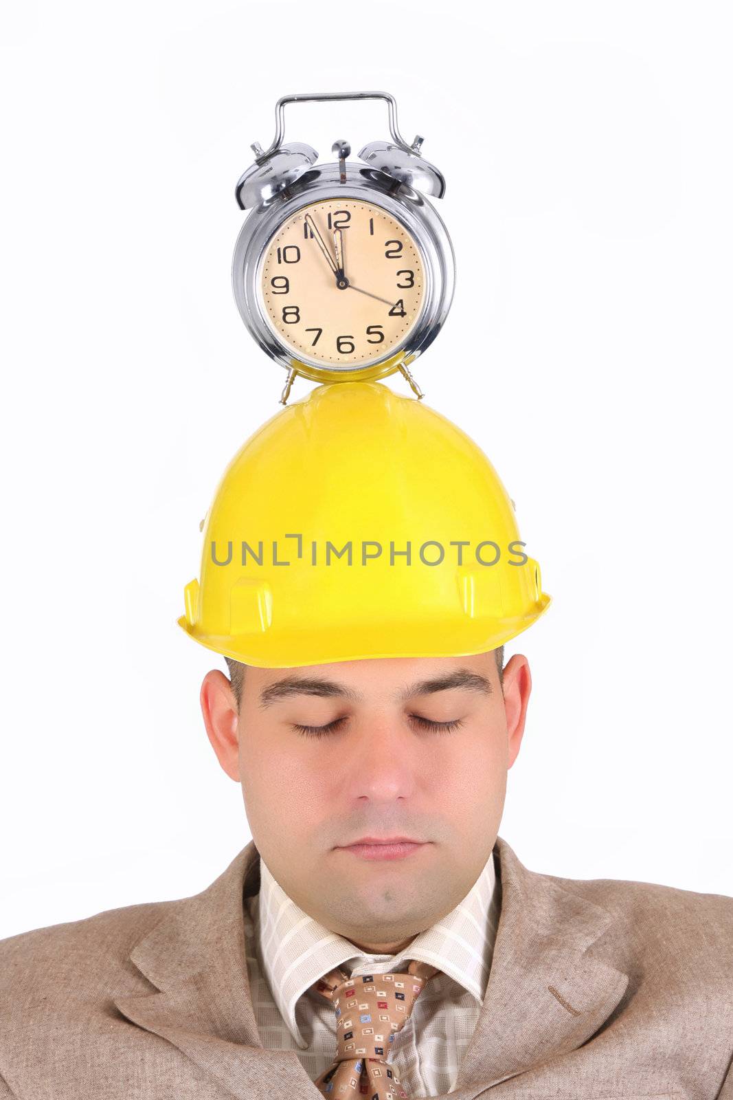 sleepy businessman with clock alarm on his head 