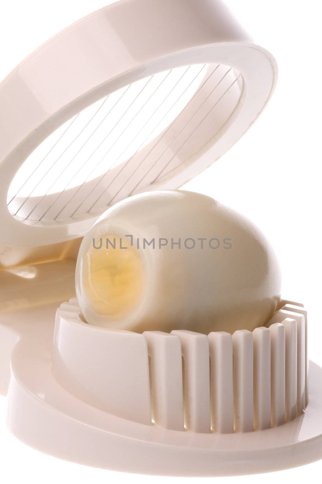 Isolated image of an egg slicer.