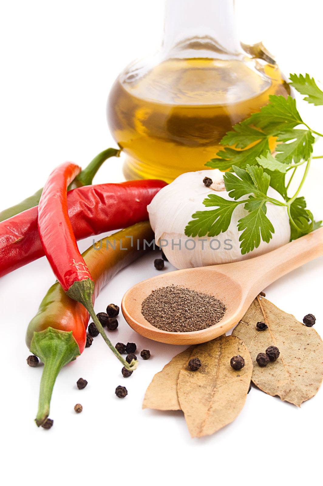 Spices and olive oil isolated on white background