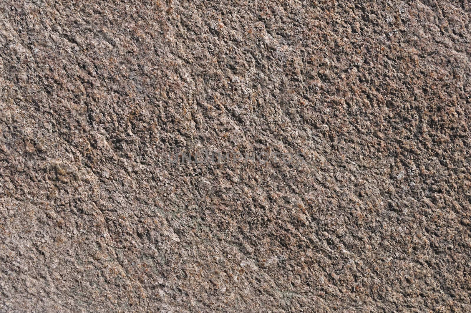 Fragment of natural brown stone surface texture