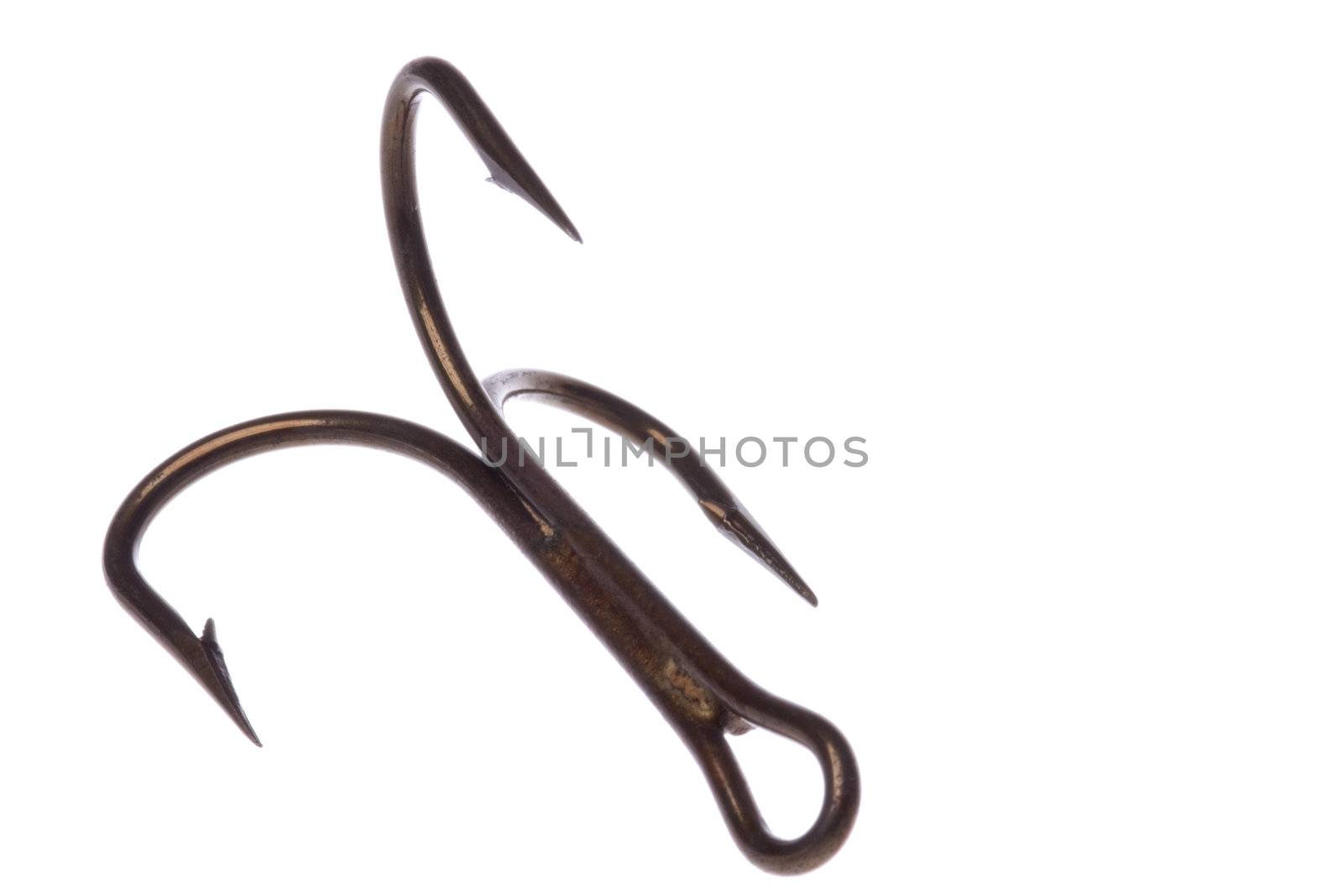 Isolated macro image of a treble fish hook.