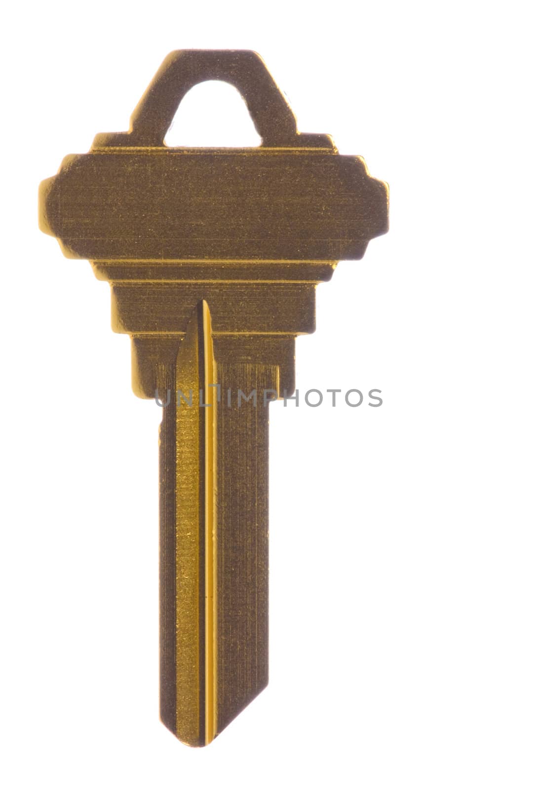 Isolated macro image of a metallic yellow blank key.