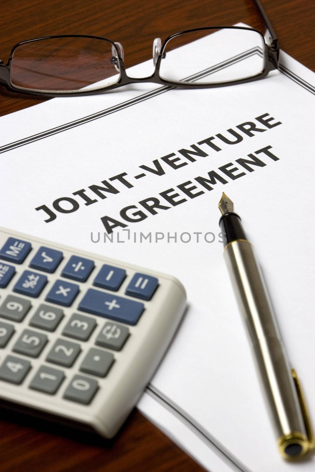 Image of a joint-venture agreement on an office table.