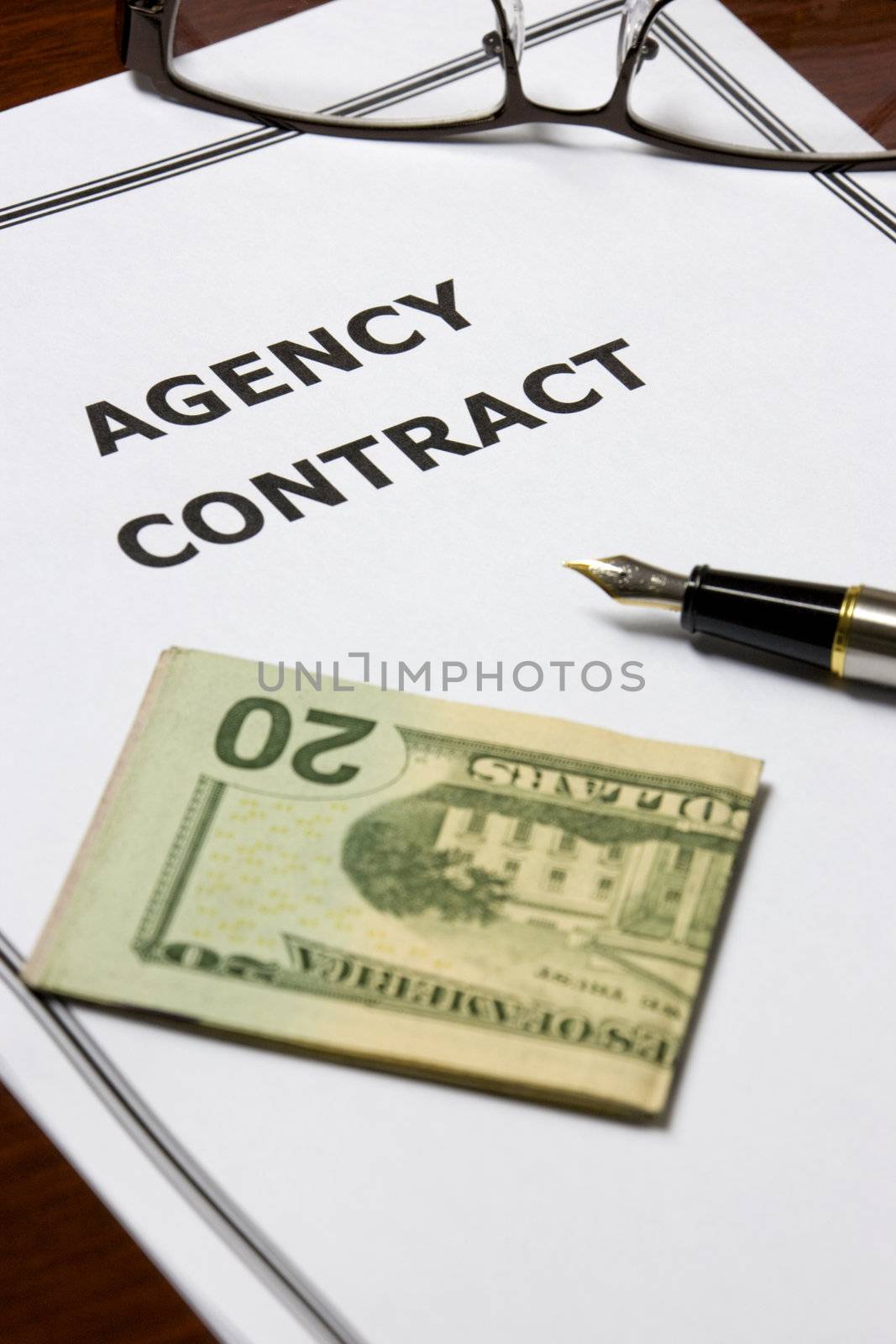 Image of an agency contract on an office table.