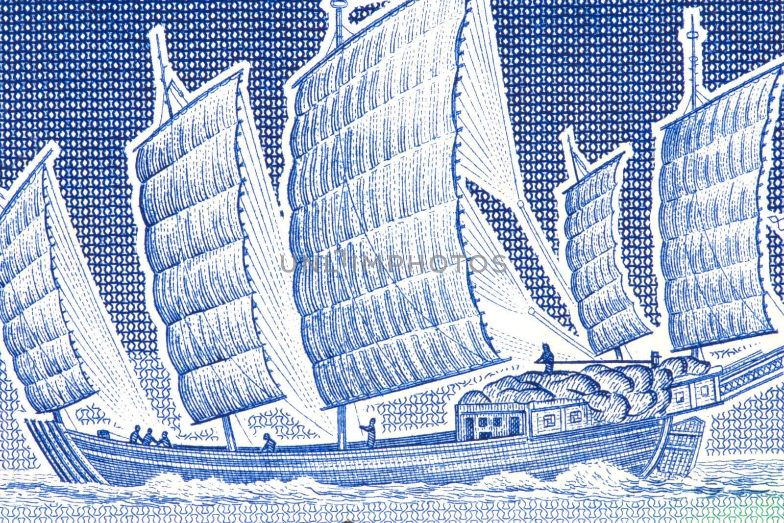 Macro image of a chinese junk on an old currency note.