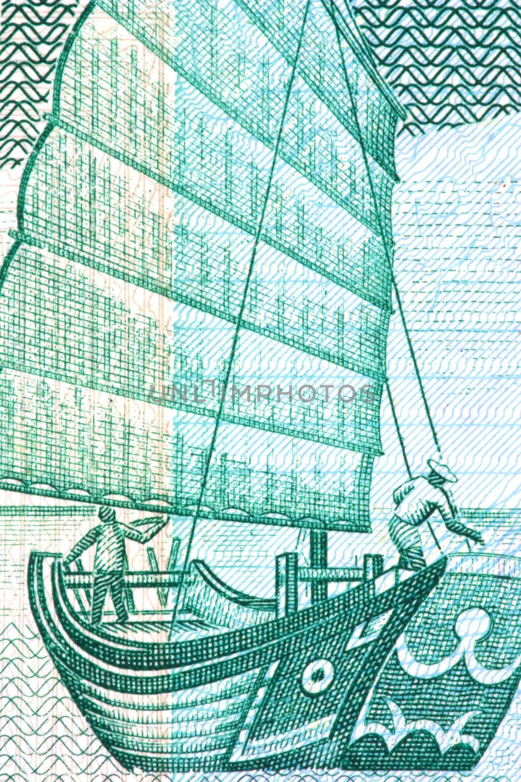 Macro image of a chinese junk on a currency note.