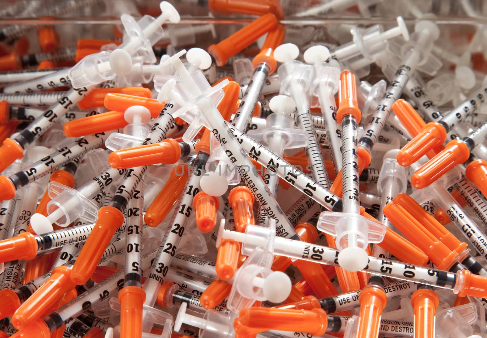 Close-up of used hypodermic syringes by steheap