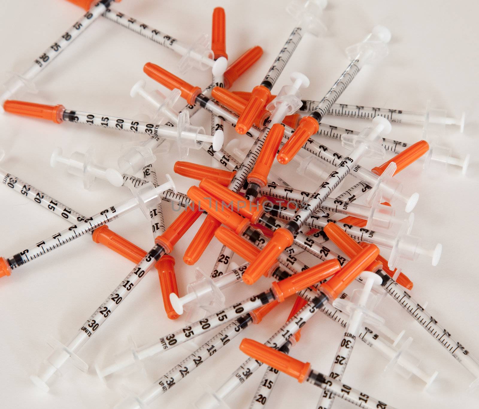 Pile of used syringes by steheap