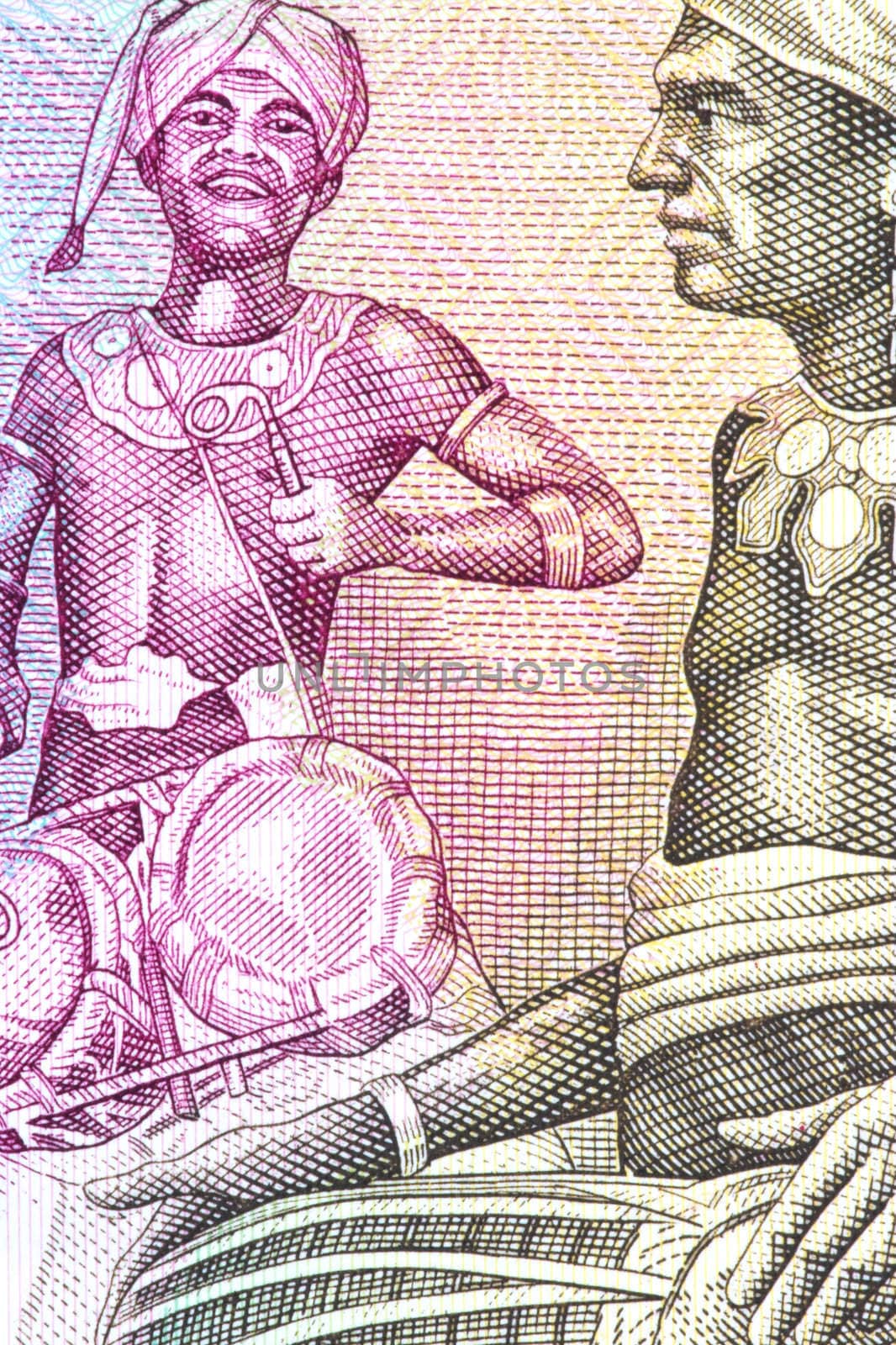 Macro image of tribal drummers on a currency note.