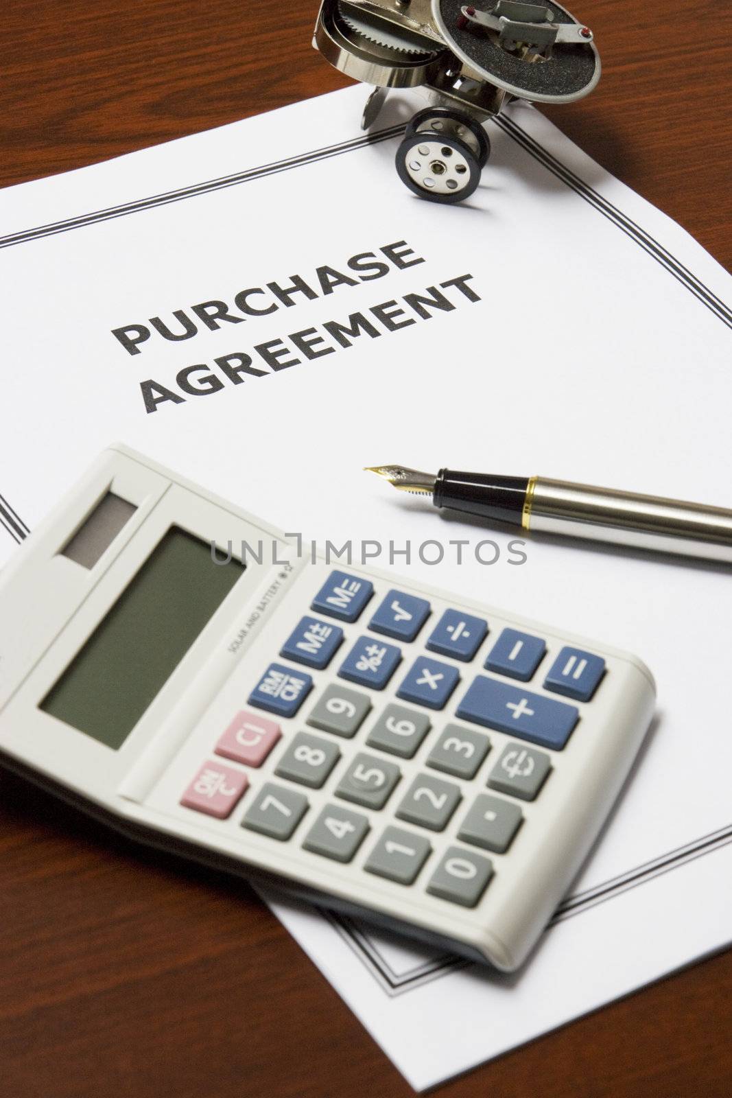 Image of a purchase agreement on an office table.