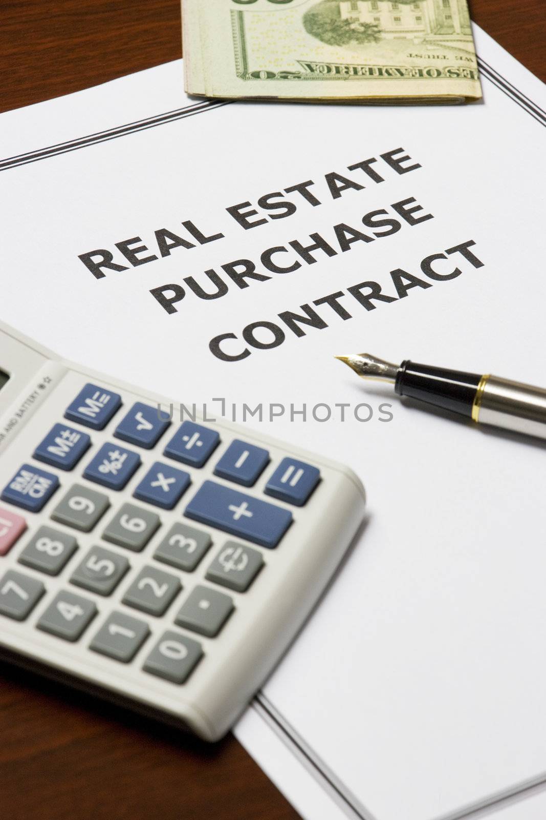 Image of a real estate purchase agreement on an office table.