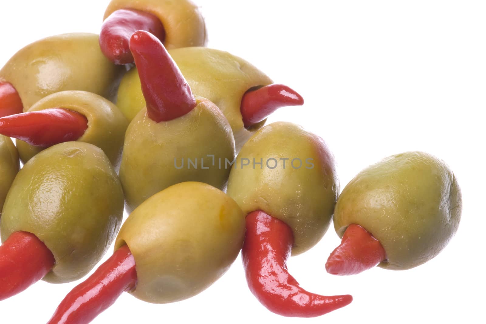 Isolated macro image of pickled pepper olives.