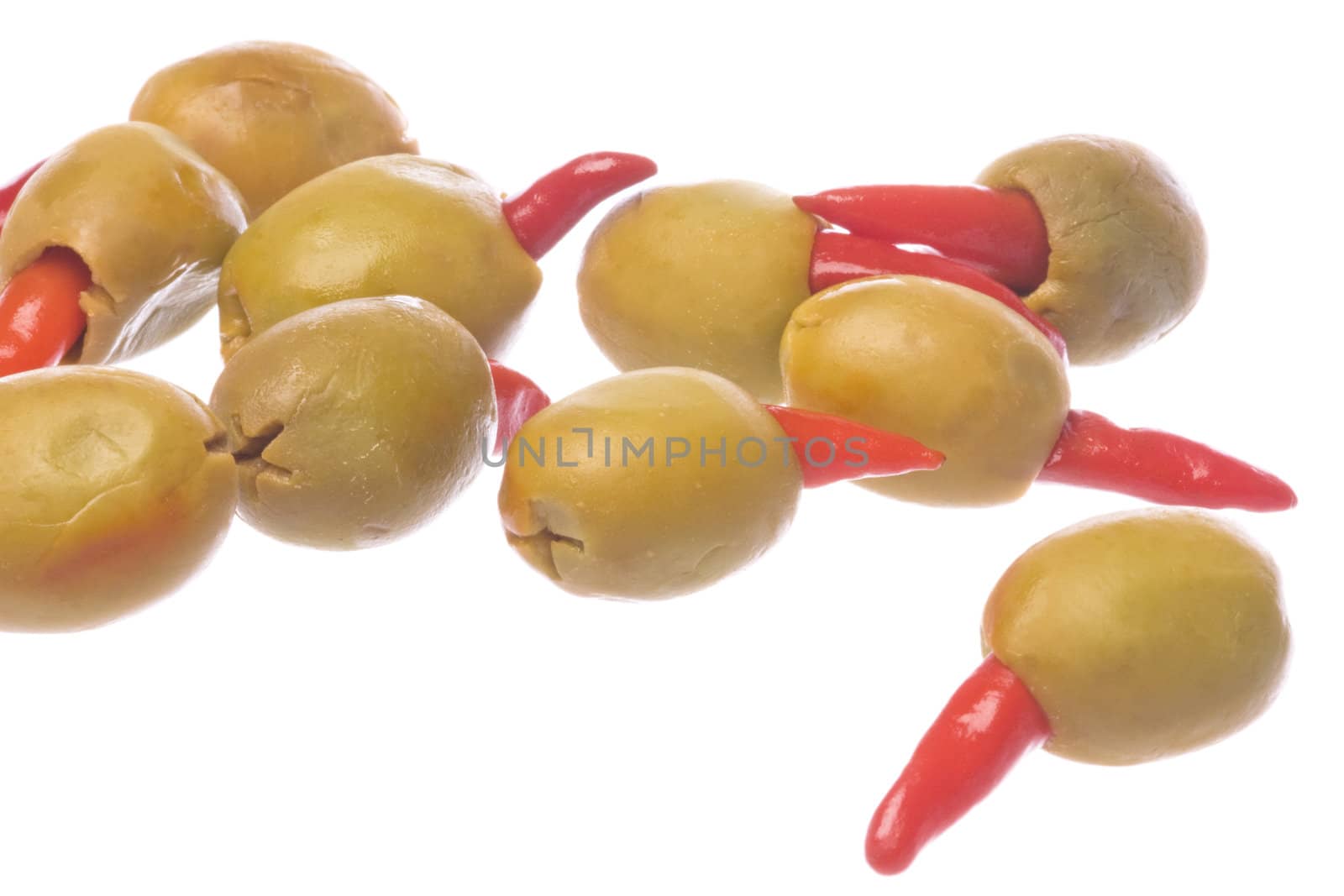Isolated macro image of pickled pepper olives.