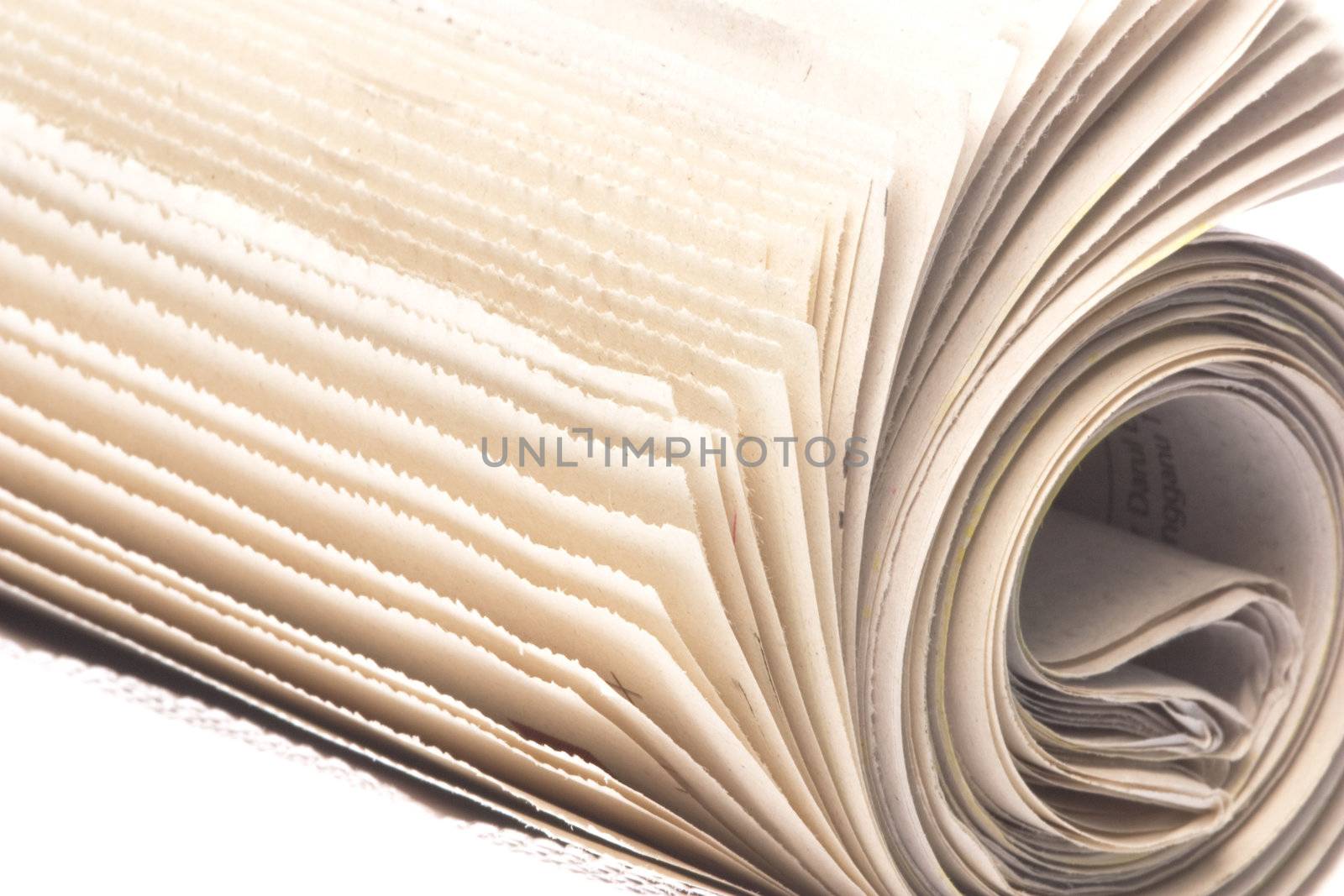 Isolated image of a roll of newspaper.