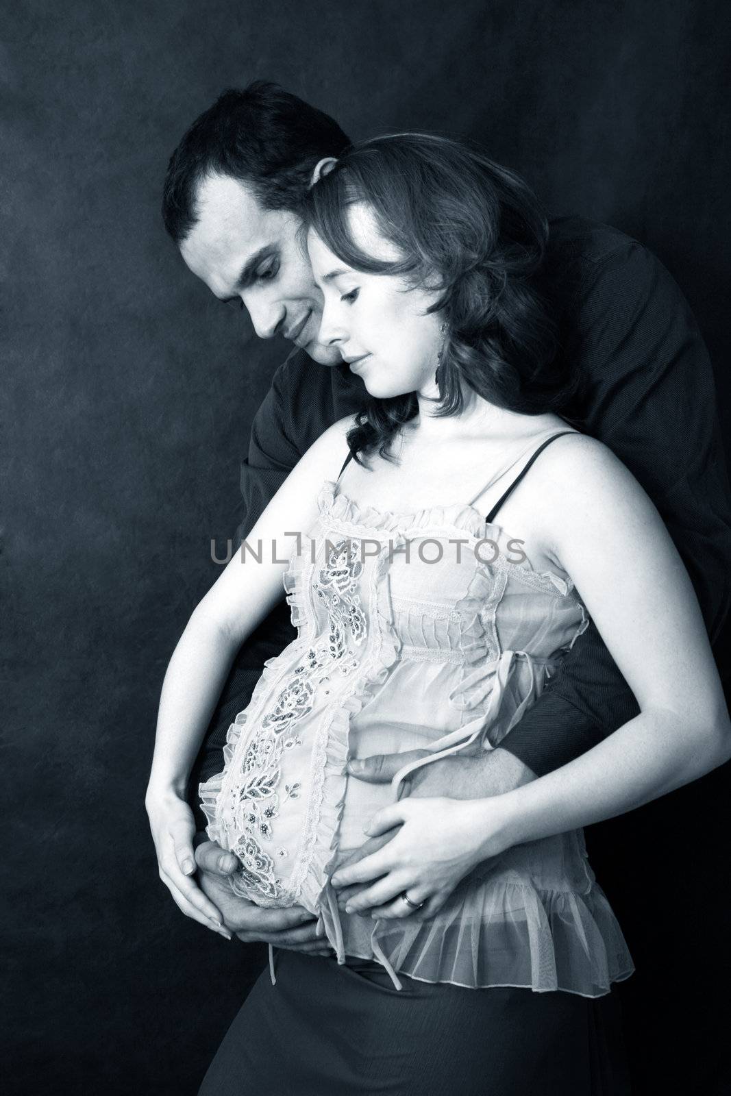 Portrait of a family waiting for their baby