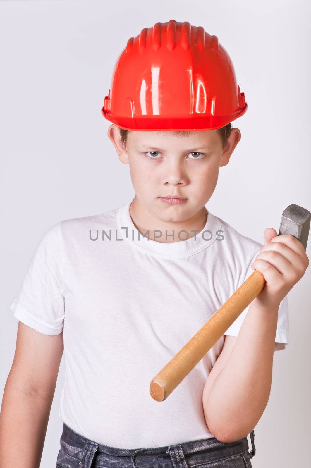 Portrait of a boy in a red protective helmet