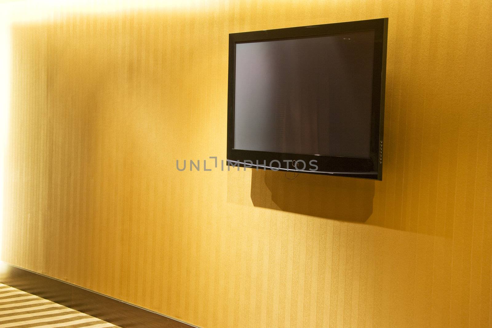 Image of a flat screen television mounted on a wall.