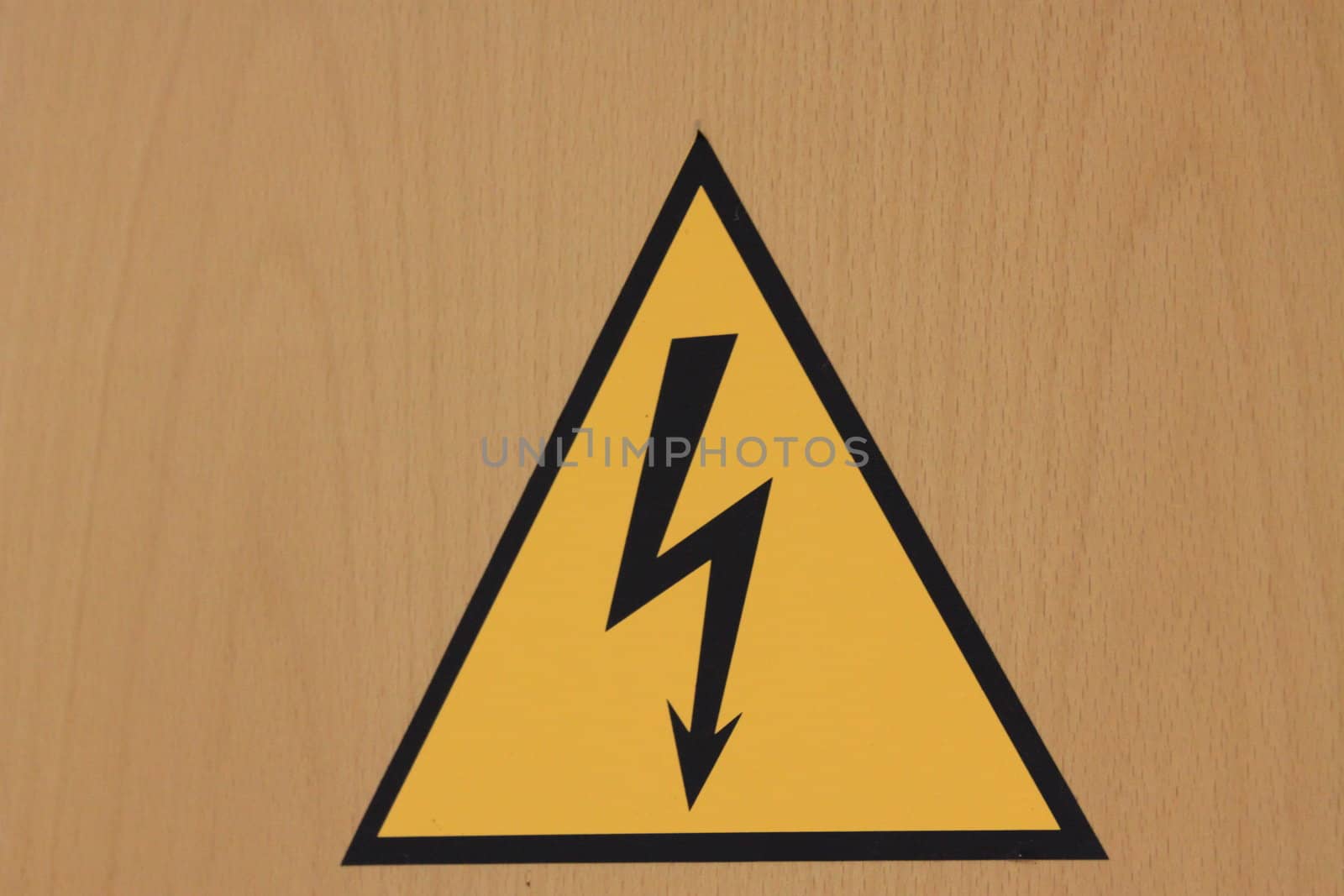 Close up of the high voltage sign on the wall.