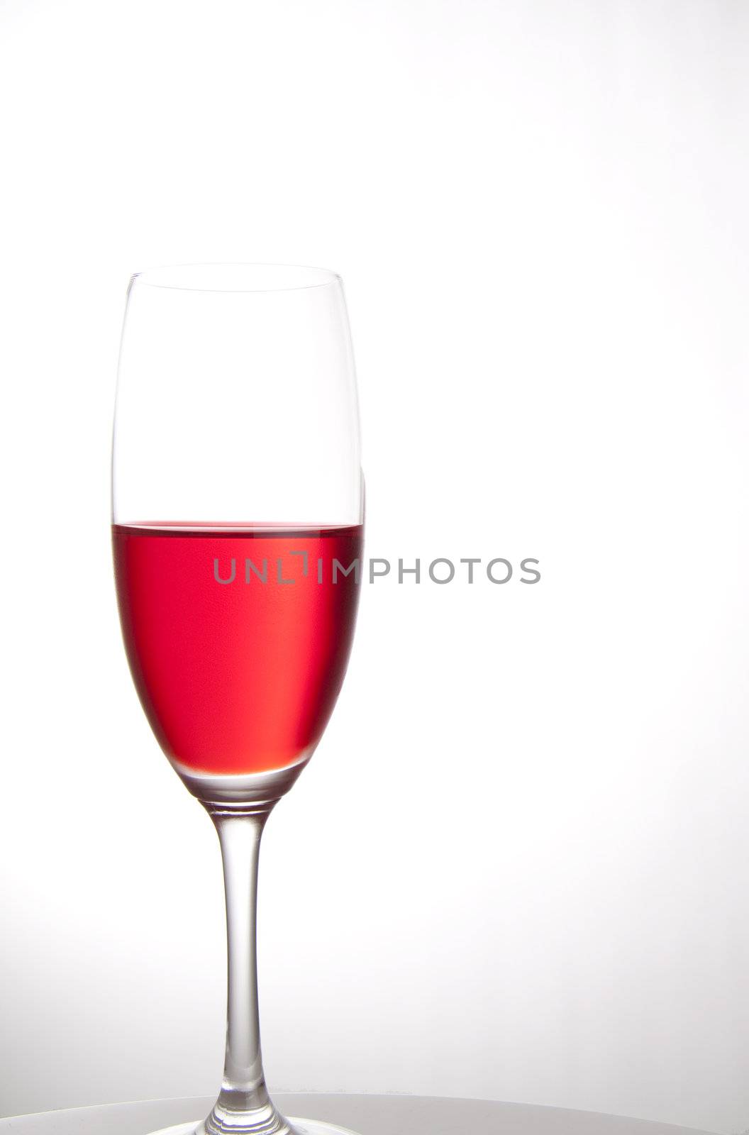 Red party drink isolated on white by kaferphoto