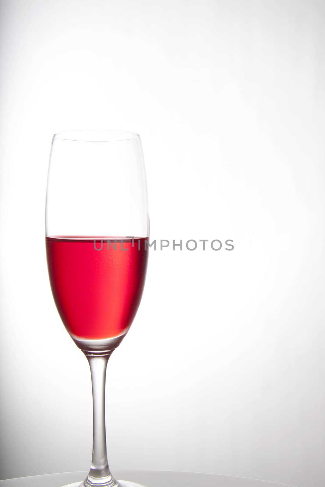 Red cocktail for a party or celebration served in a champagne glass
