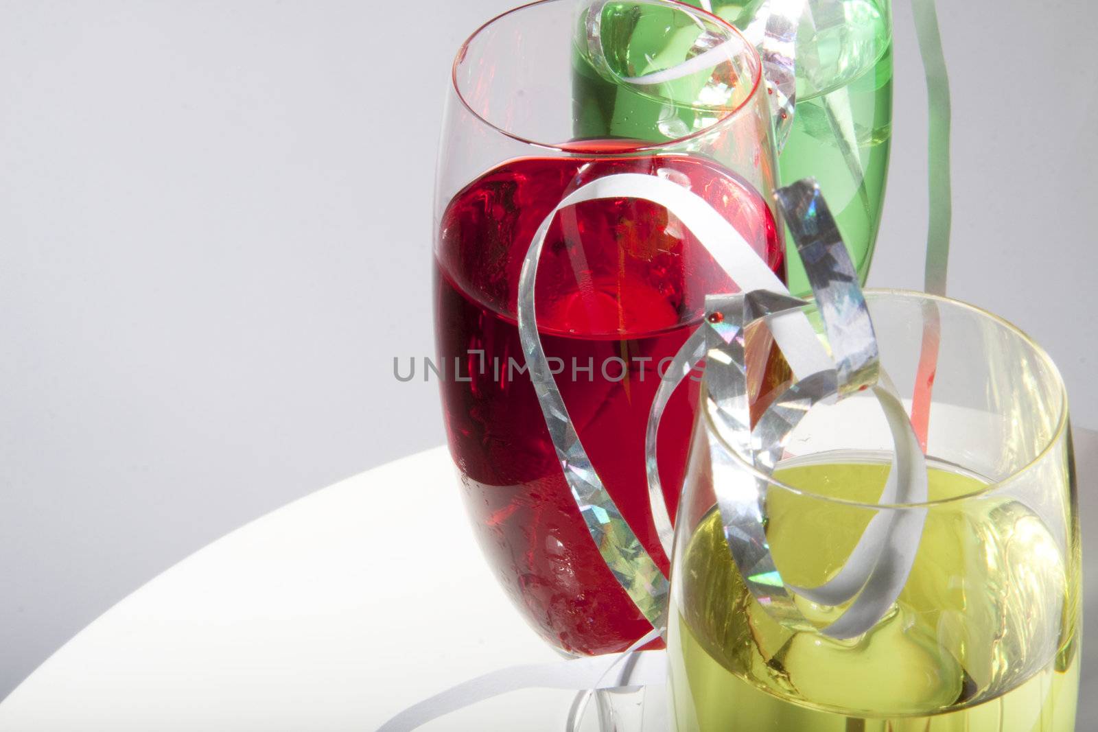 Colorful cocktails for a party decorated with silver streamers