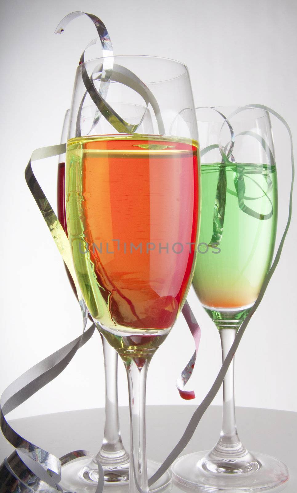 Colorful cocktails for a party decorated with silver streamers