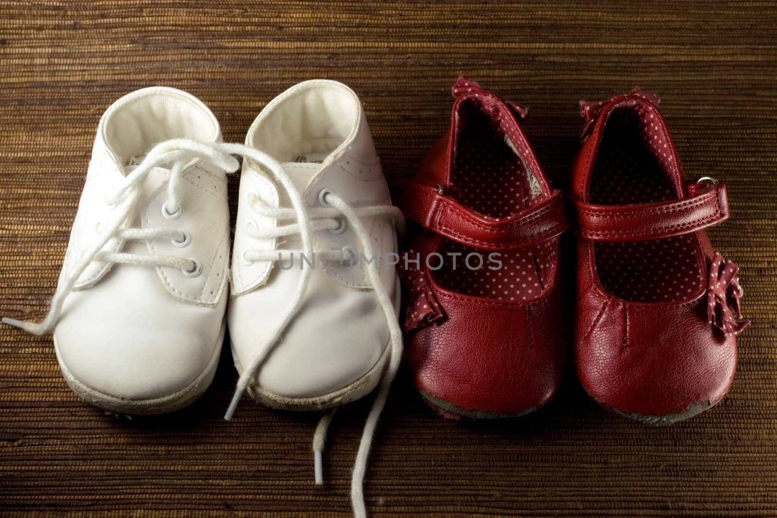 two pairs of worn baby shoes
