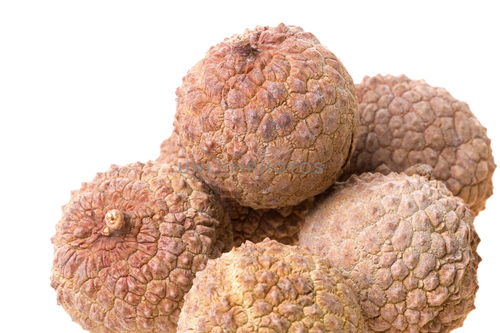 Isolated macro image of dried lychees.