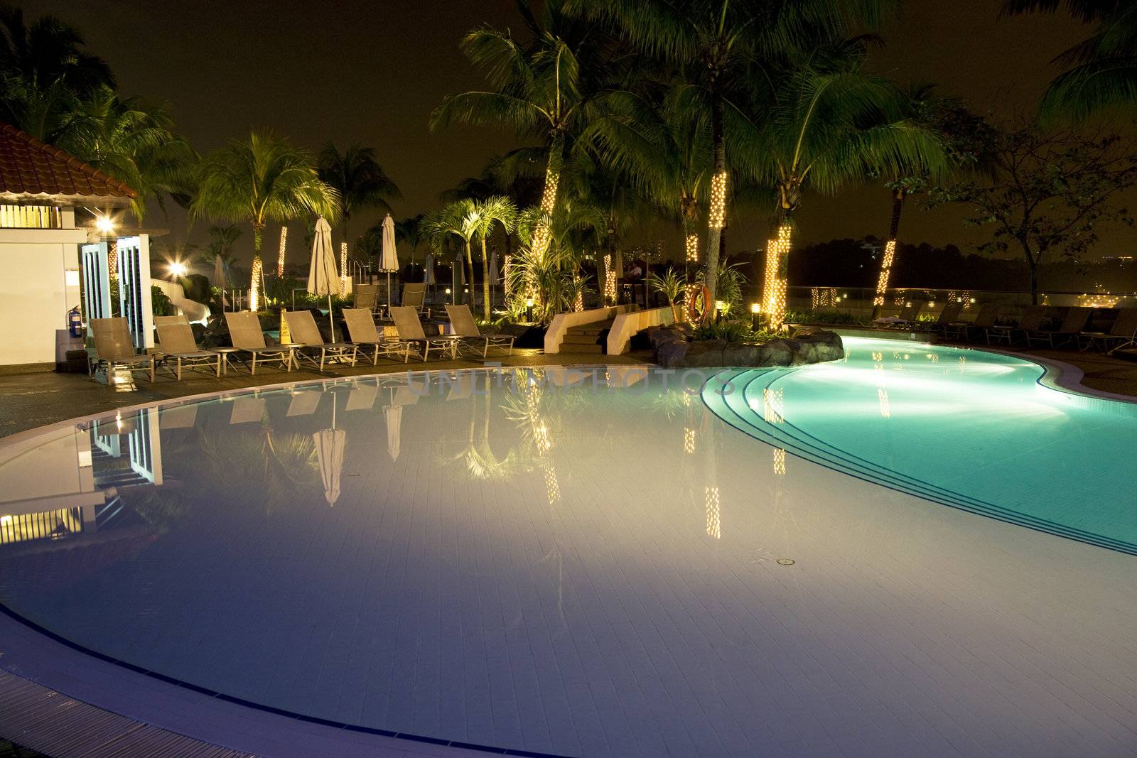 Night image of a swimming pool in Malaysia.