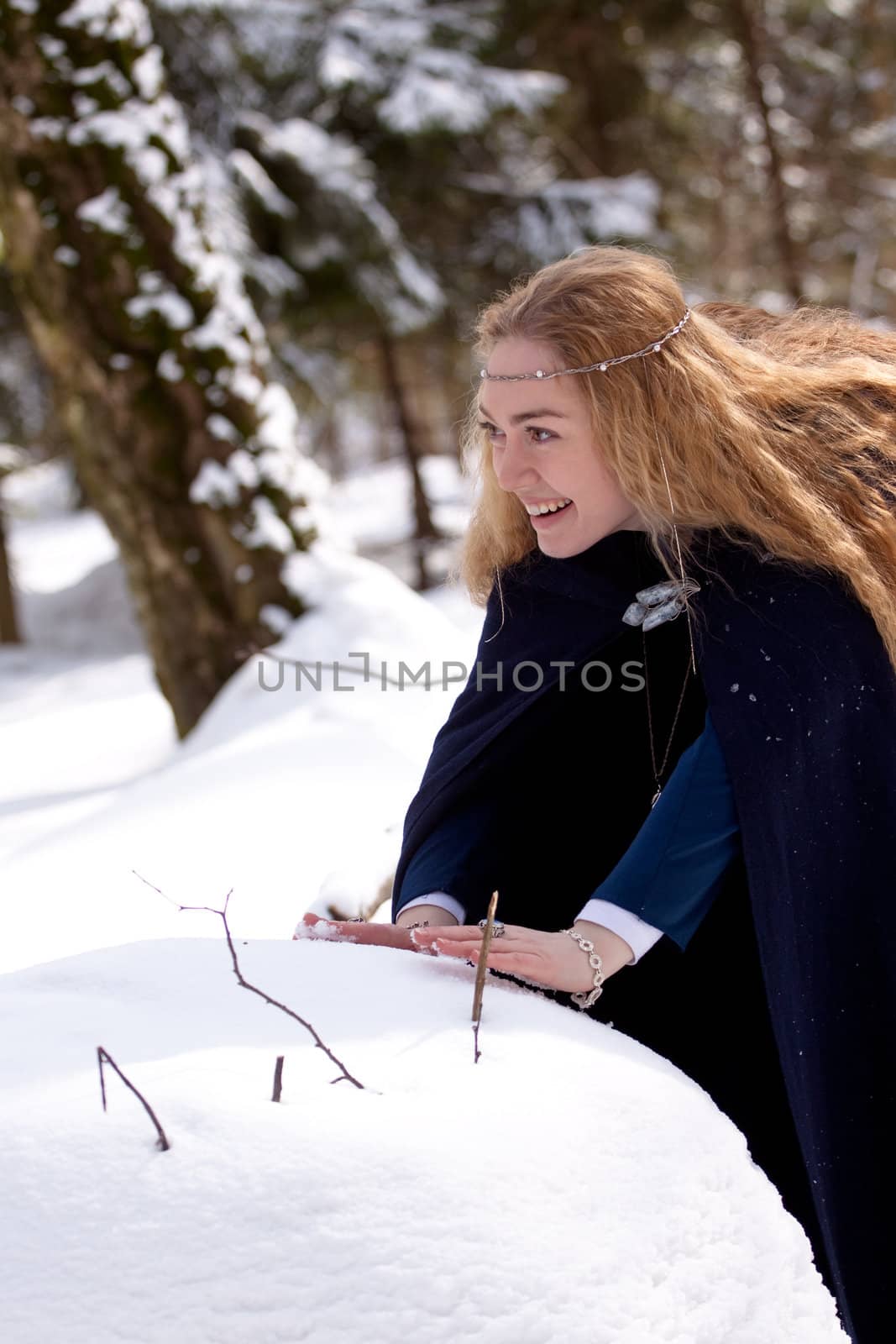 Lady in blue dress and snowball
