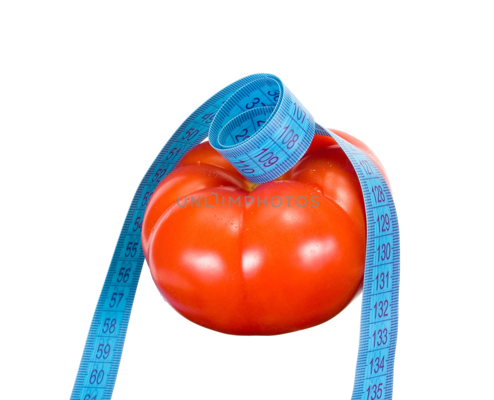 tomato and tape measure isolated on white background