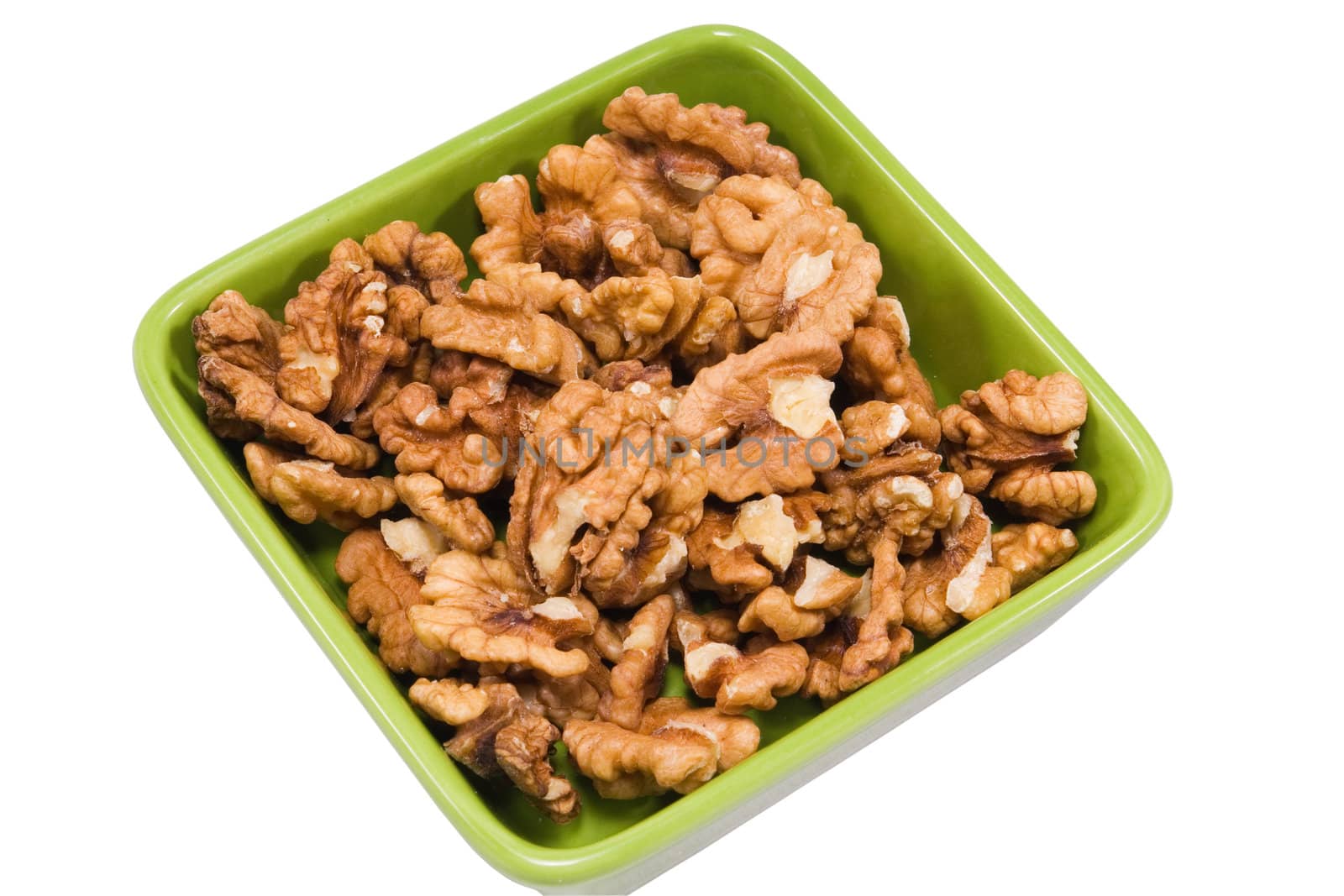 walnuts in plate isolated na white background