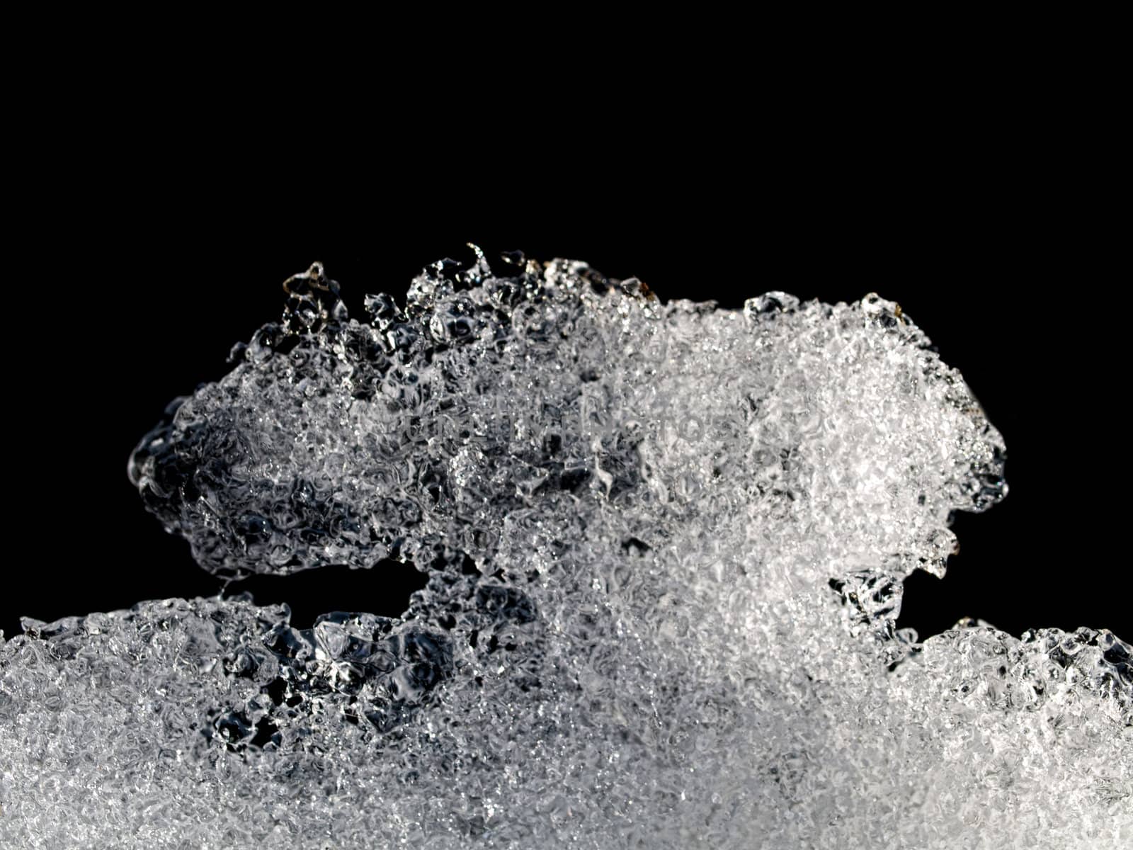 Macro of an ice structure on black background