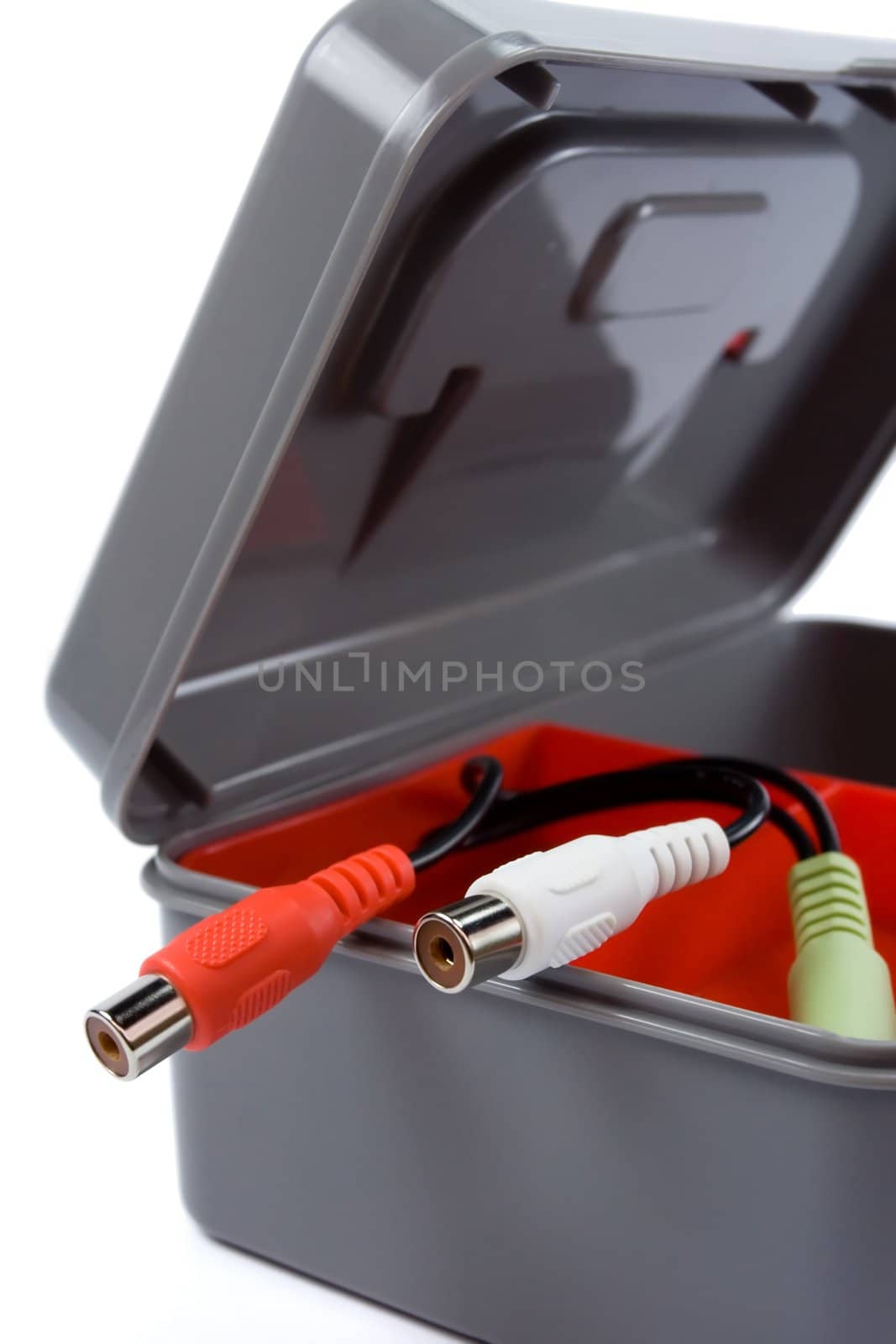 new and clean plastic tool box with audio cable plugs isolated on white