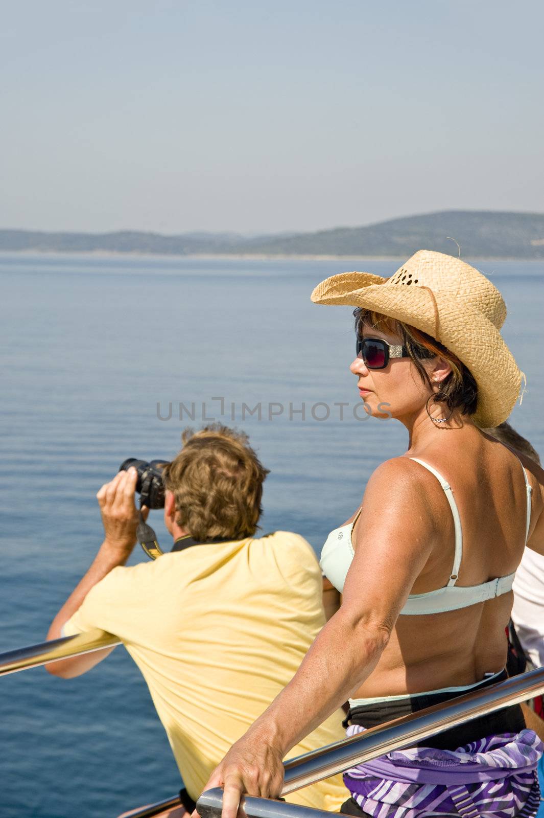 Tourists on a deck of the excursion ship, taken in Croatia