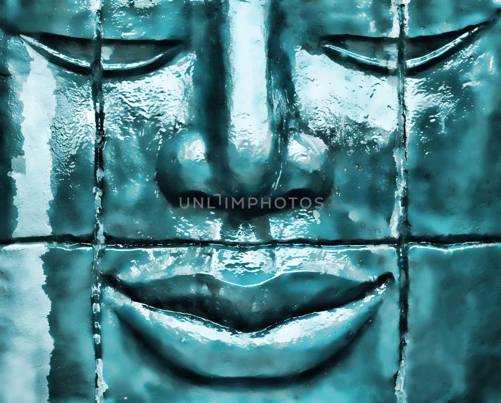 Zen statue made of stone with water dripping