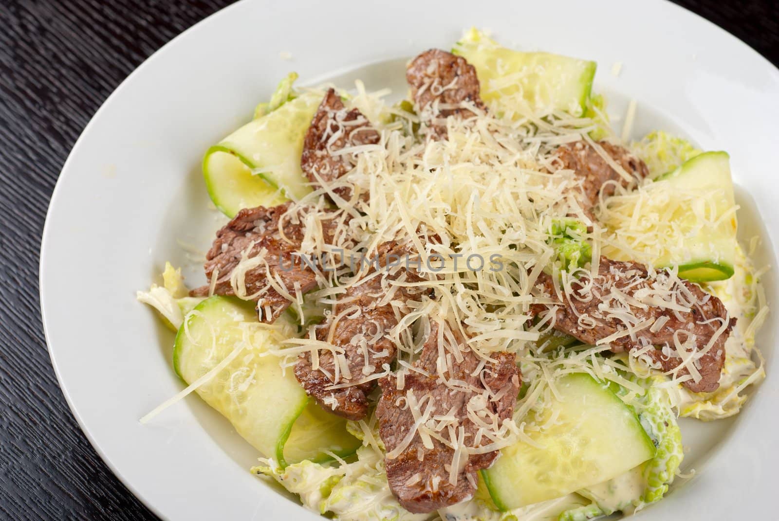 Salad with beef, lettuce, cucumber, string beans, Chinese cabbage and sauce