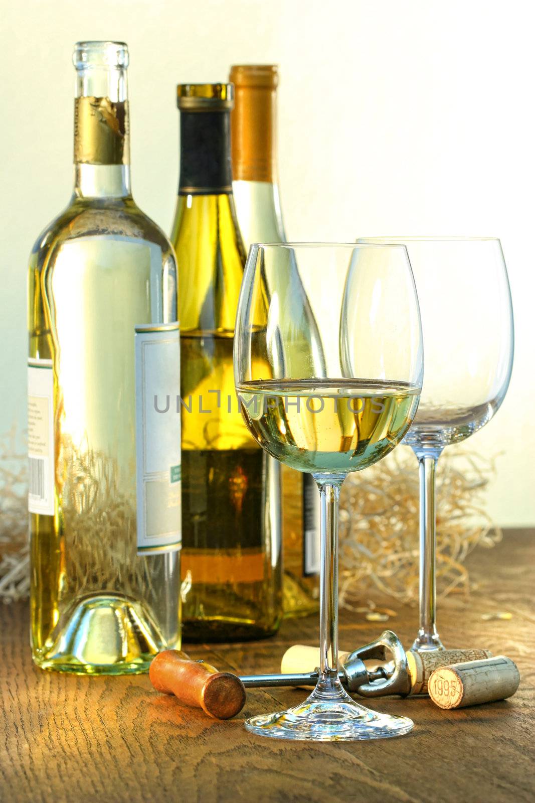 Bottles of white wine with glasses ready for wine tasting