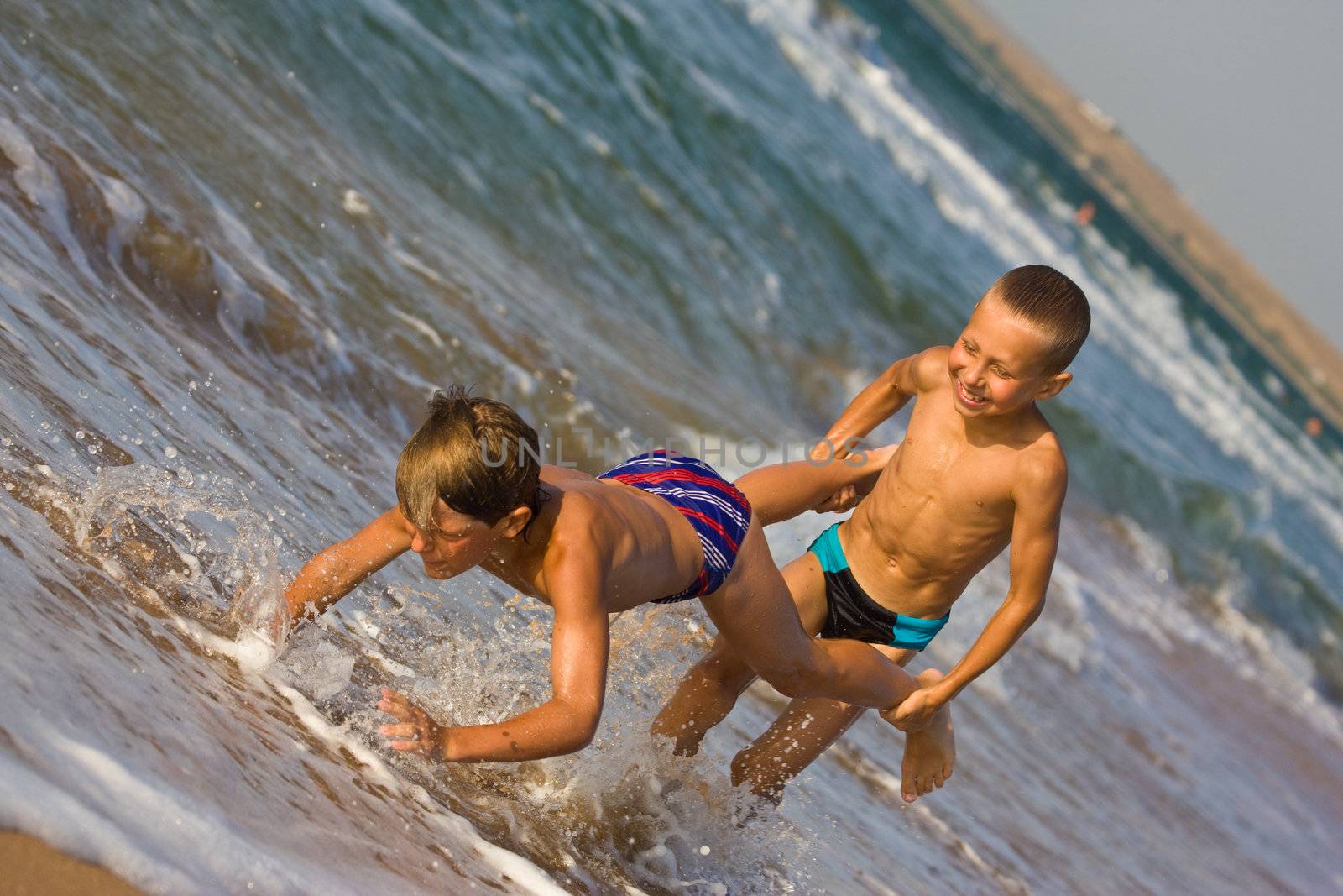 people series: two boy are play the game on sea beach