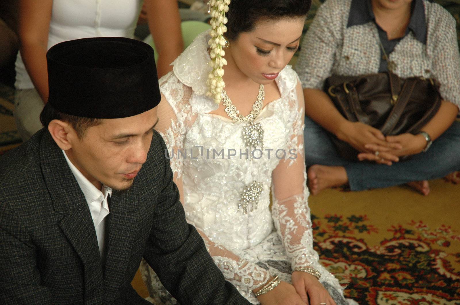 bride and groom wearing traditional costume from west java-indonesia