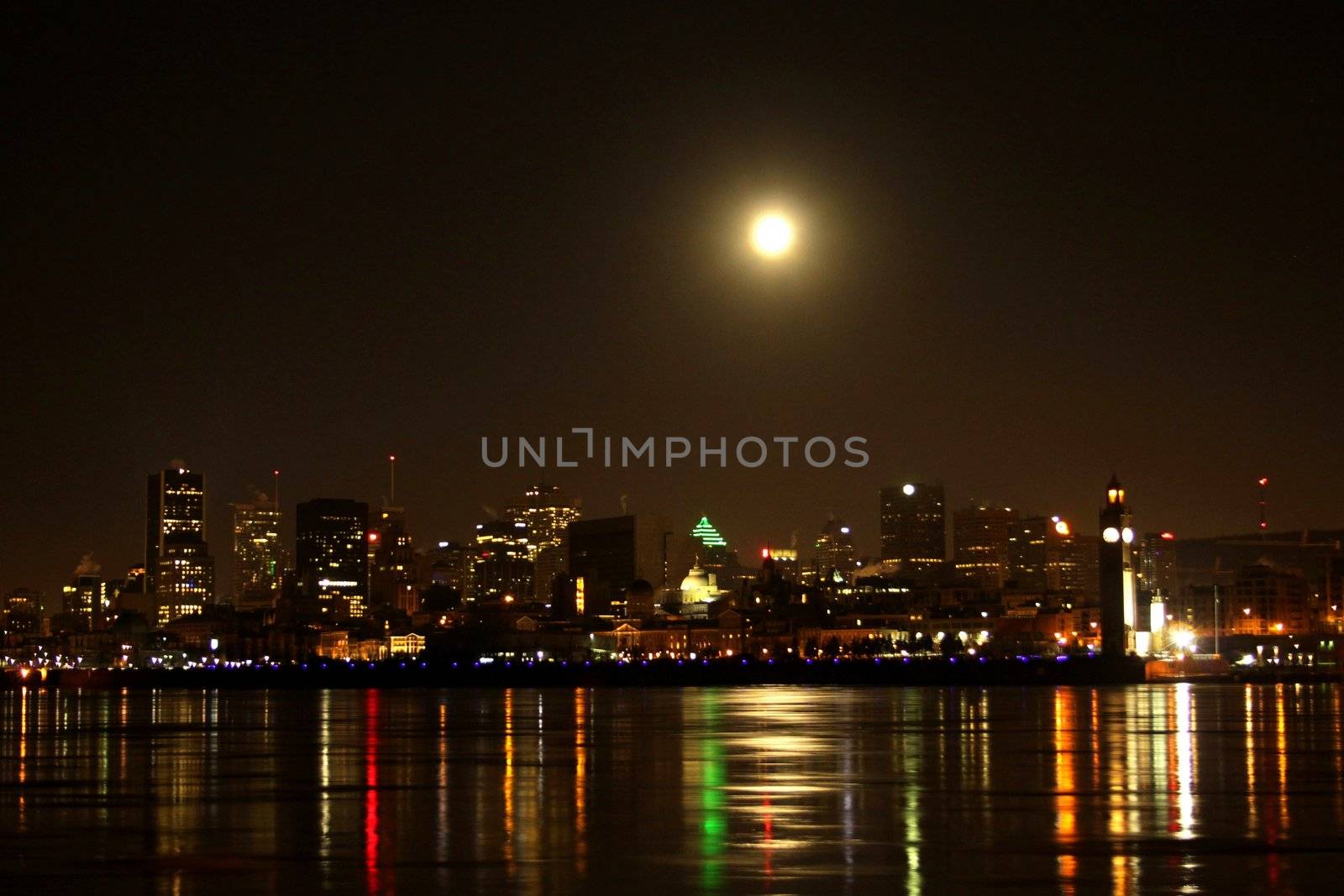 End of night full moon over Montreal cityscape