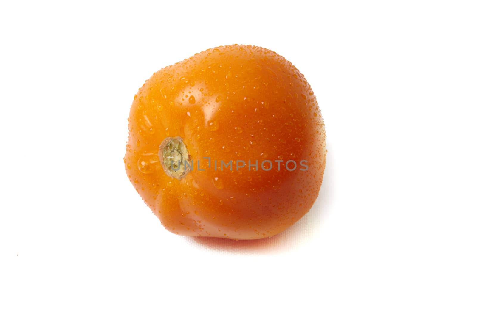 Orange tomatoe isolated on white background