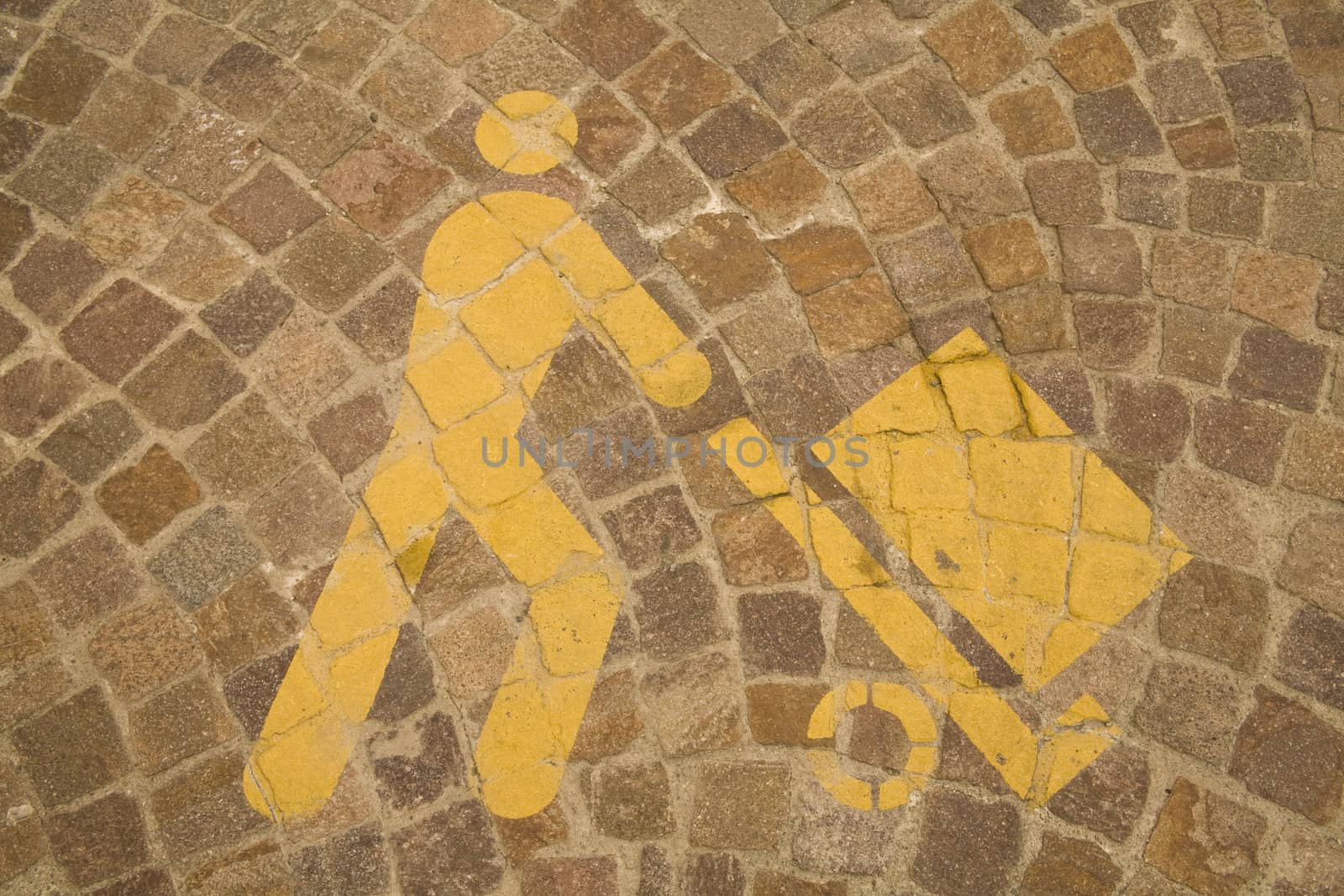 Yellow parking symbol on the floor, signaling a  loading and unloading area.